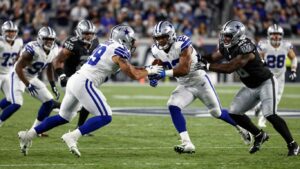 Cowboys vs. Raiders football game action shot.