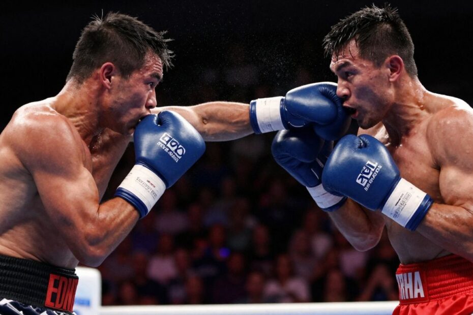 Boxing match action shot with dramatic lighting.