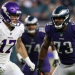 Vikings and Eagles football players in intense action.