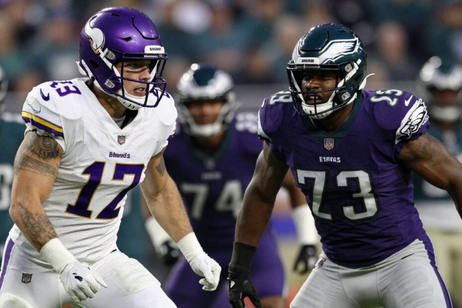 Vikings and Eagles football players in intense action.