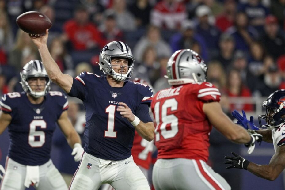 NFL players in action during a touchdown play.